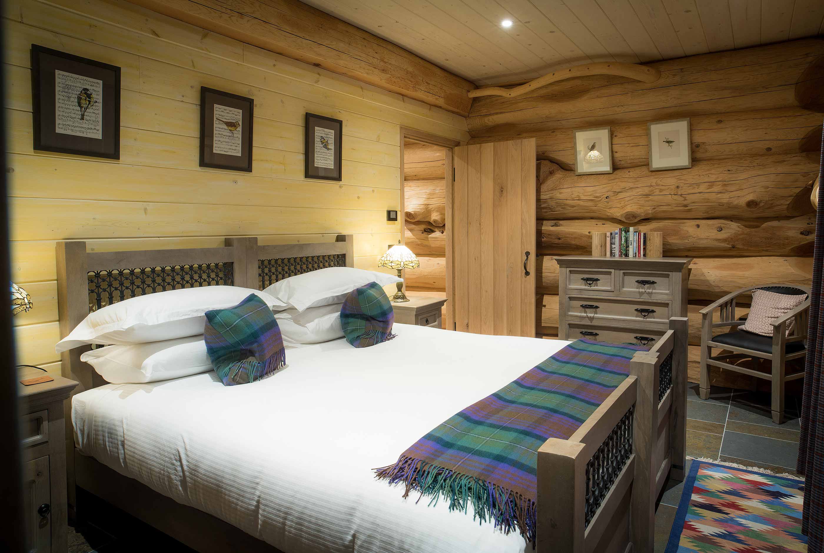 Bedroom inside Ardea log cabin