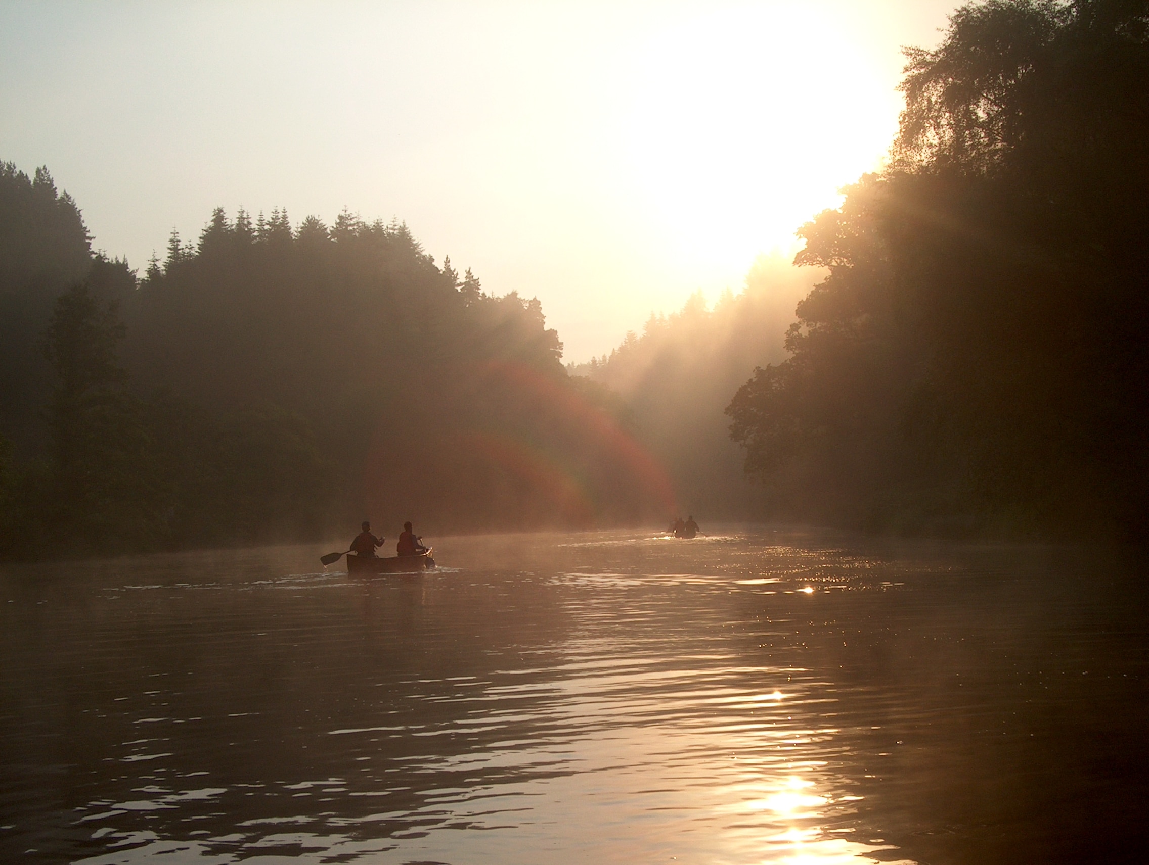 Canoeing on a misty lake in the Highlands