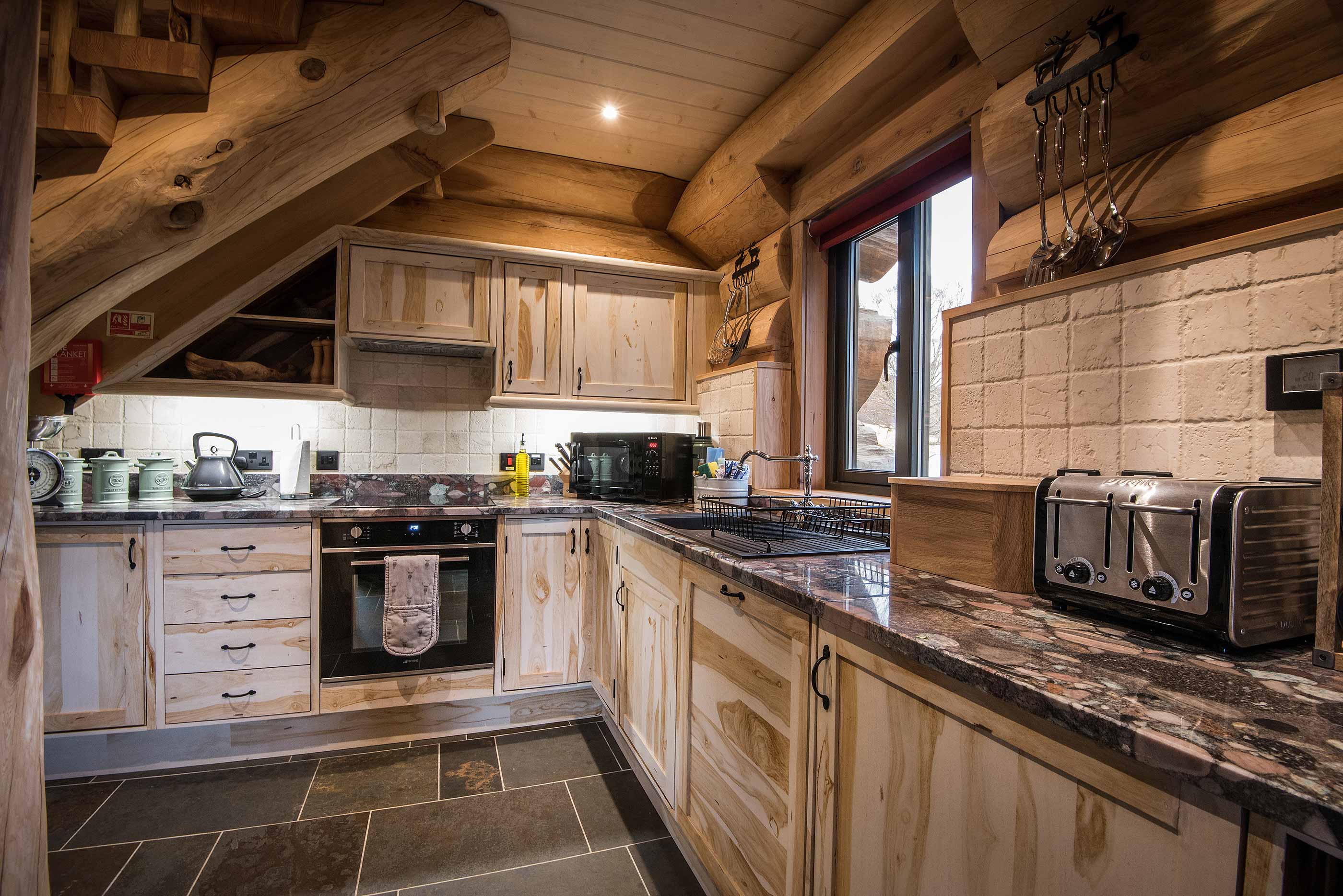 Kitchen inside Cinclus log cabin