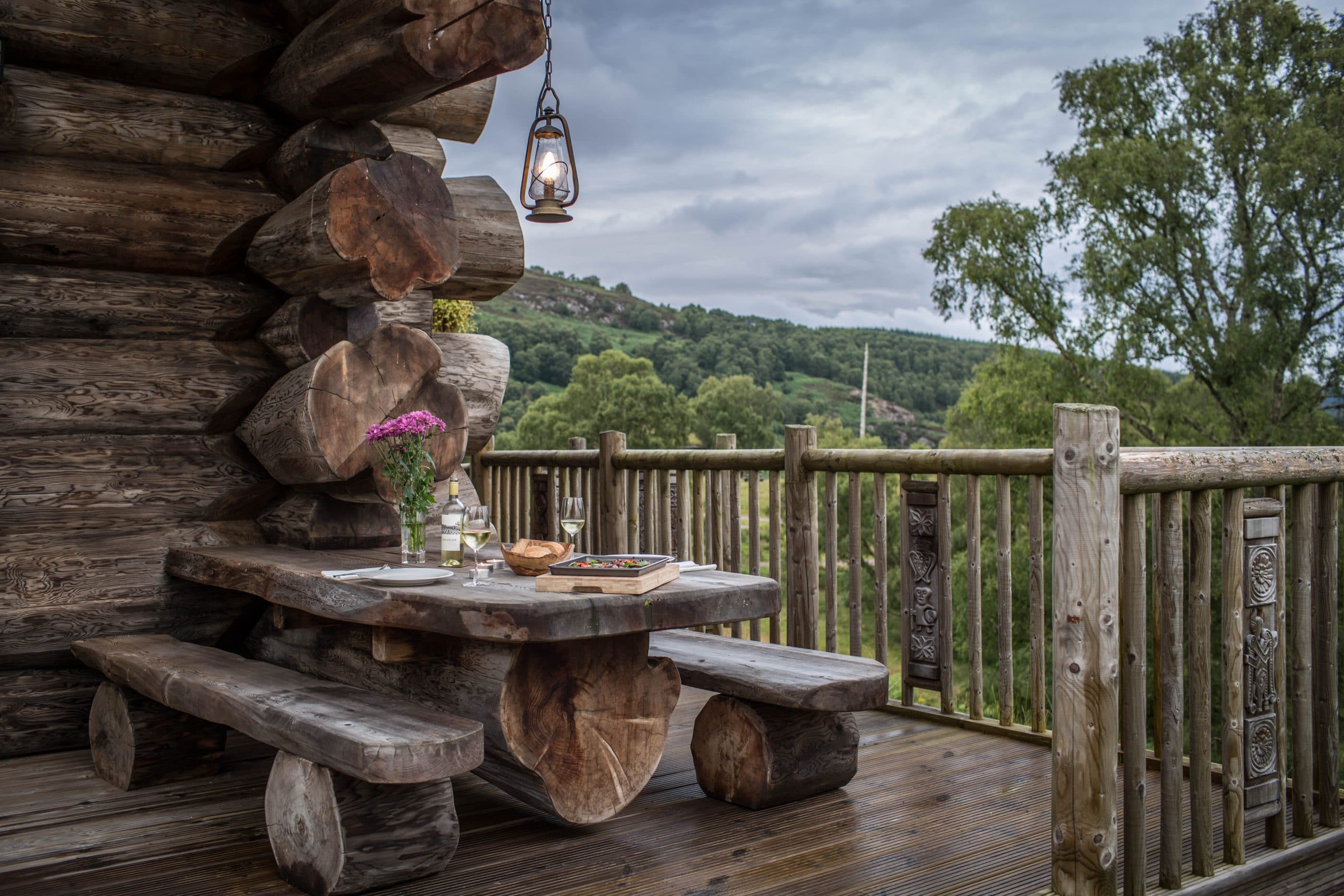 Outdoor seating area of luxury log cabin