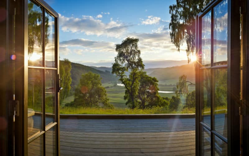 Sun rising over the hills seen from the deck at Tringa