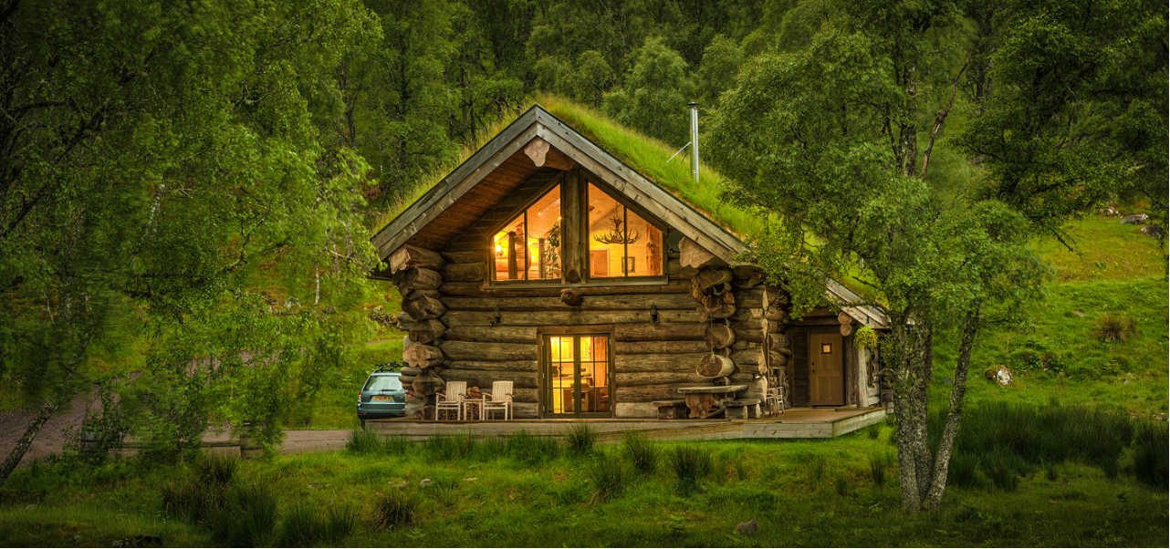 A log cabin with turf roof in Scotland