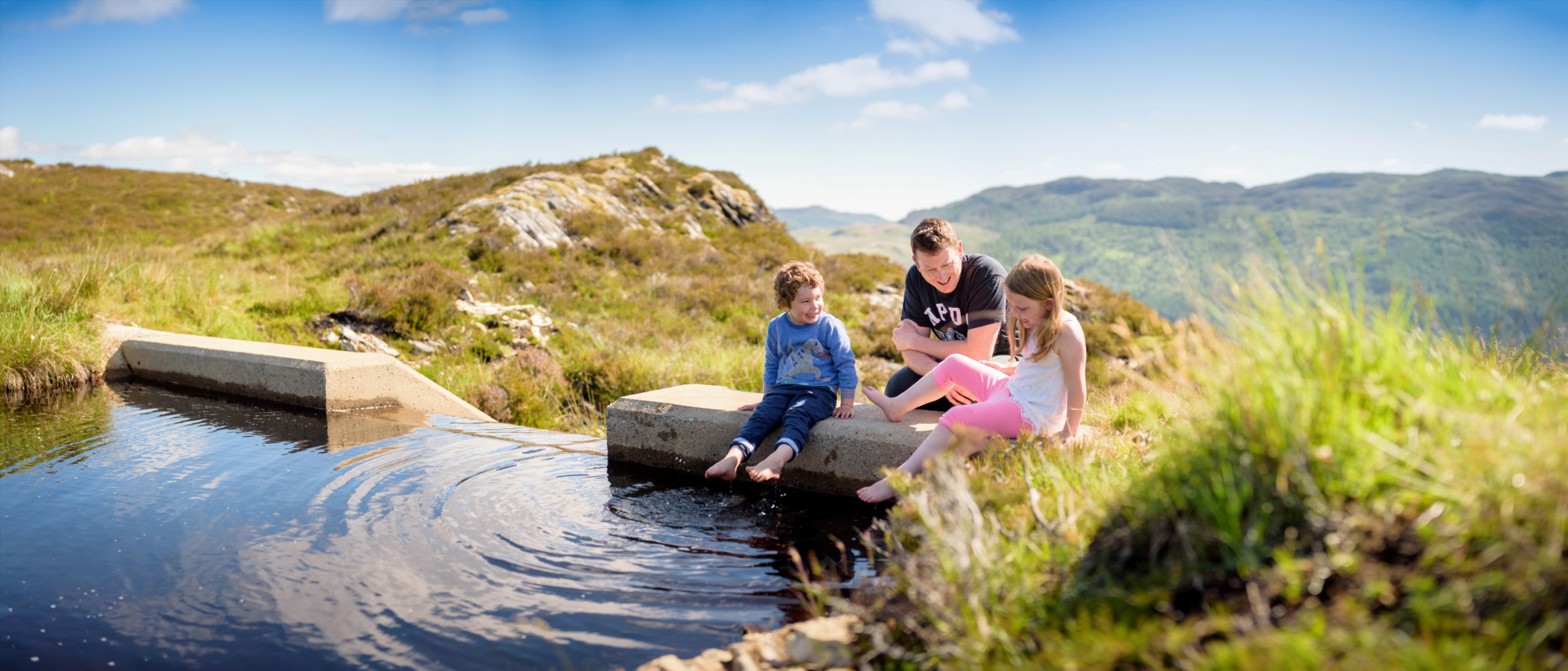 Family enjoying a nice day at our micro-hydro scheme