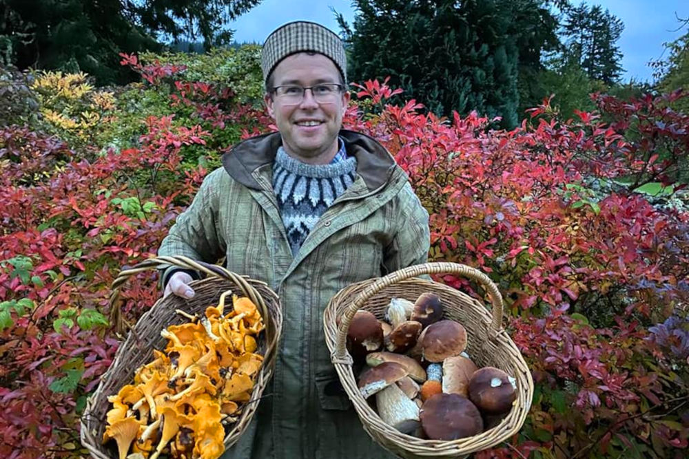 Mike from Eagle Brae with foraged ingredients in baskets