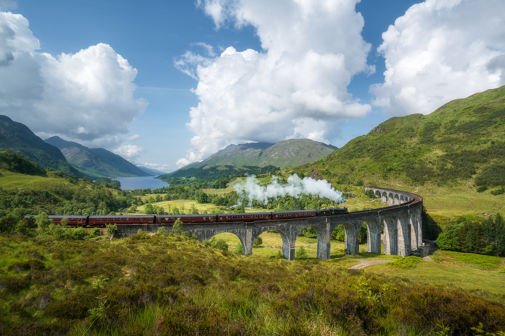 Steam train crossing the Glenfinnan viaduct 