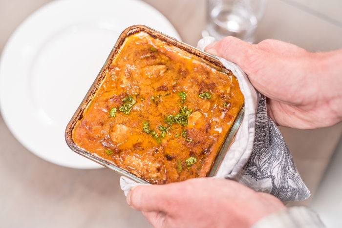 Top Chicken Curry Recipe dish being carried to plate up