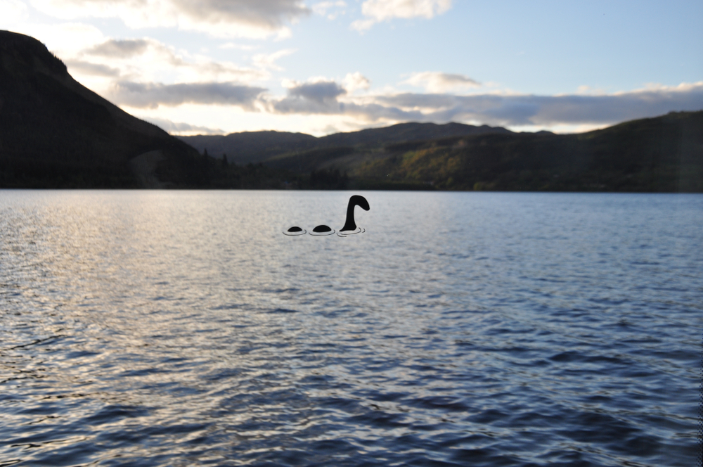 A sticker of Nessie, the Loch Ness monster on the window pan.