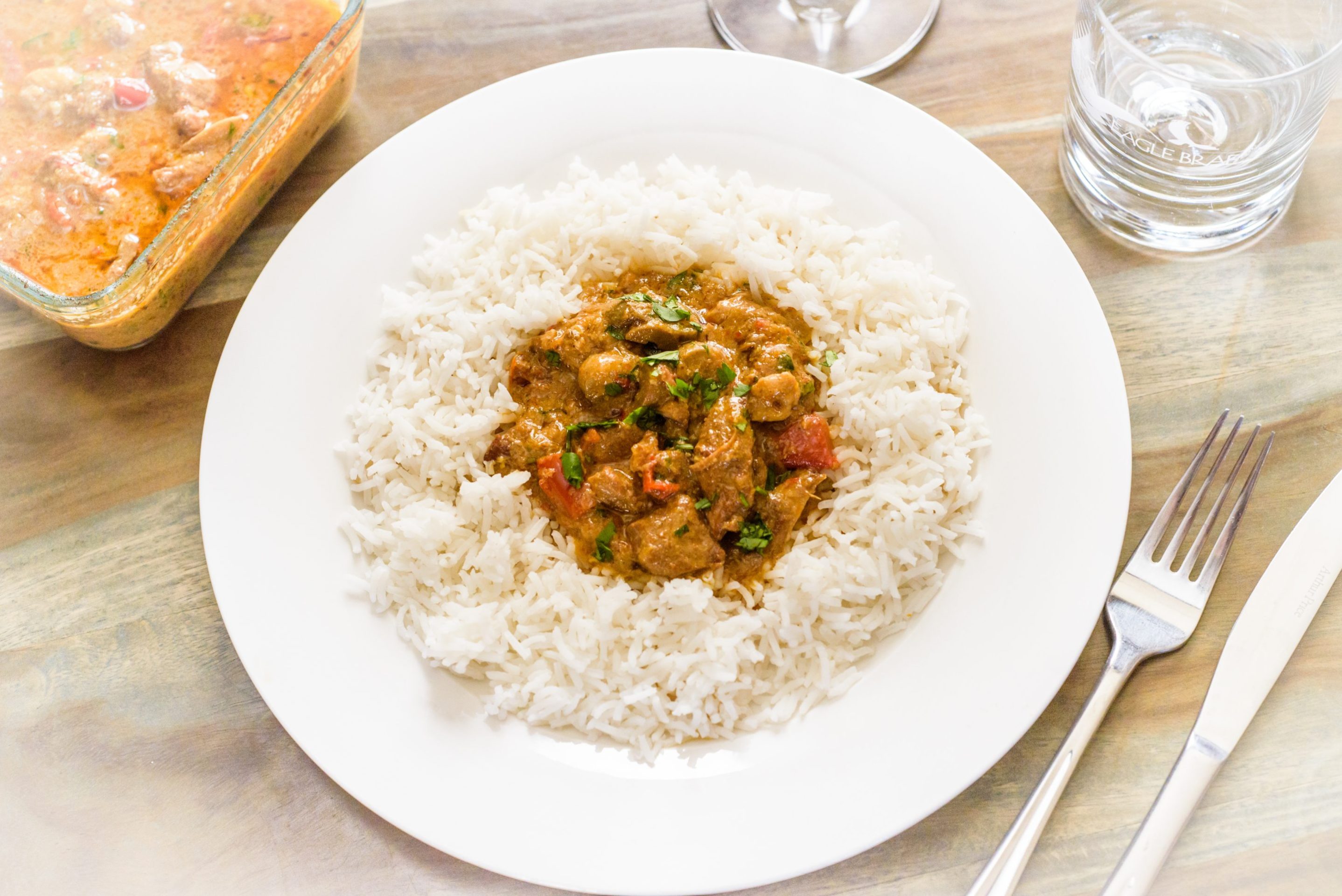 Homecooked Eagle Brae Pondicherry pork curry served on a plate with rice