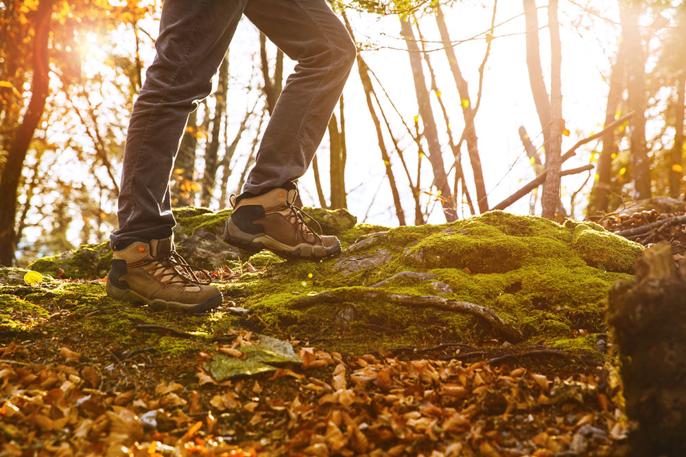 Hiker wearing walking boots in autumn