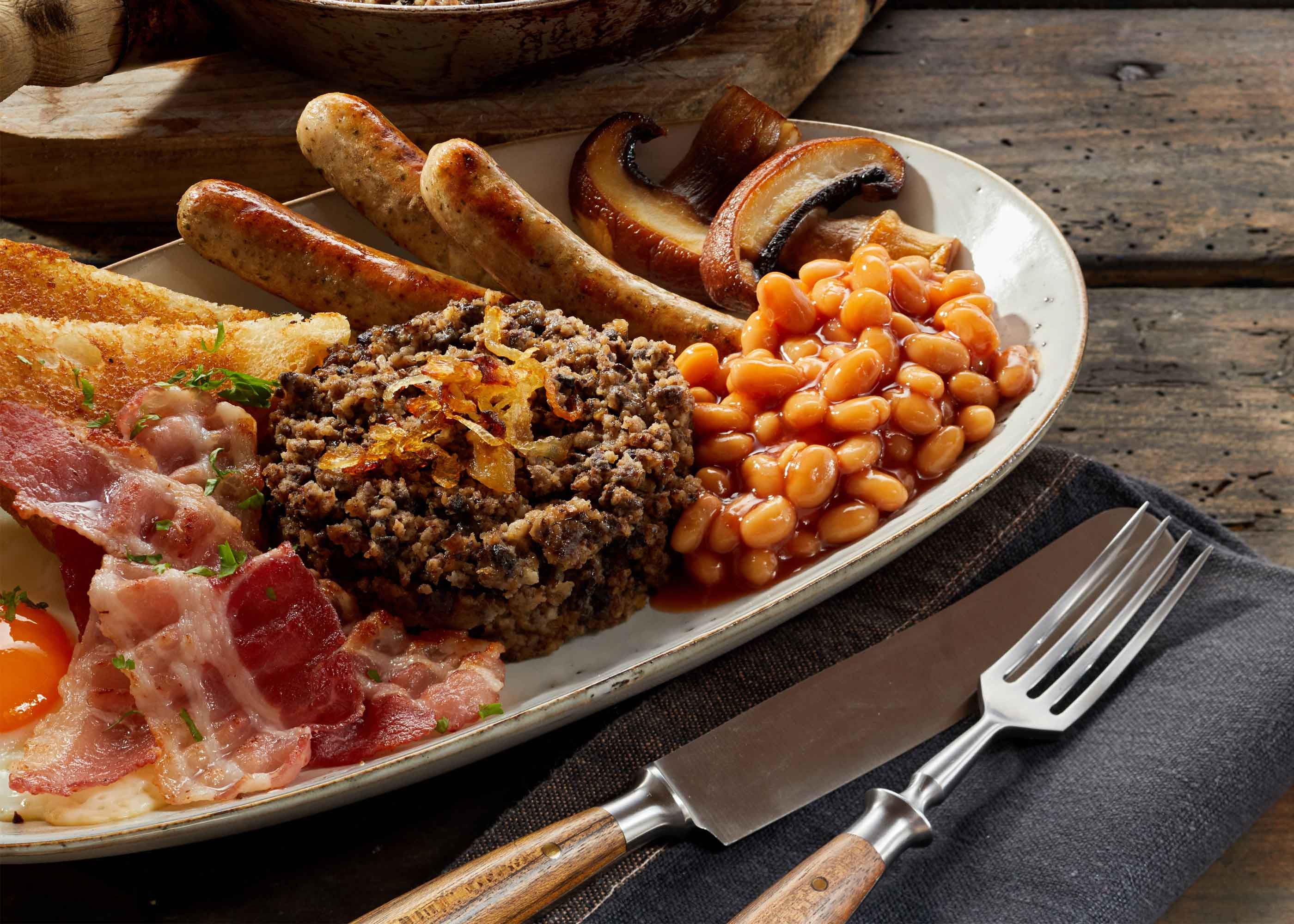 A cooked Scottish Breakfast on wooden table