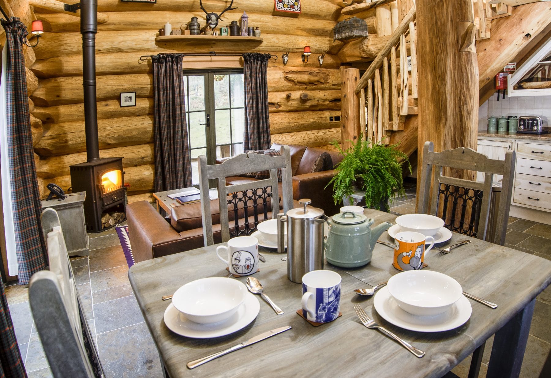 Dining table laid out in Sylvia log cabin