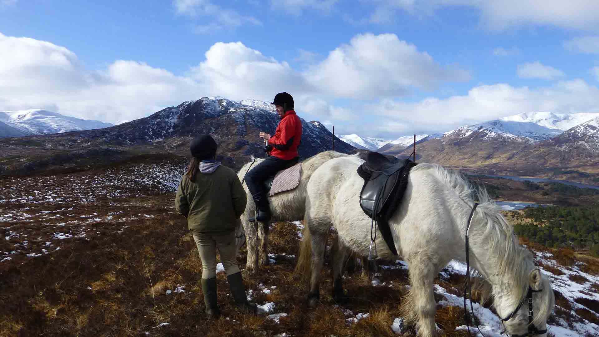 Pony trekking in the Highlands of Scotland with snow