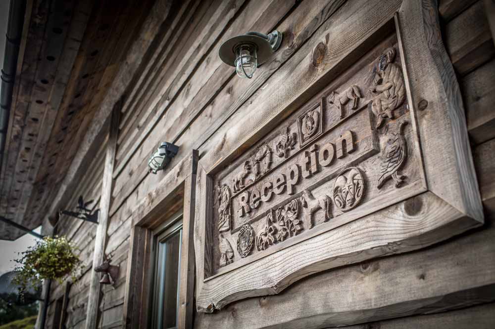 Hand carved reception sign at Eagle Brae