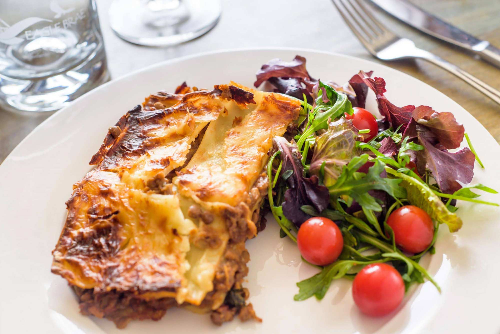 Lasagne and salad on a plate