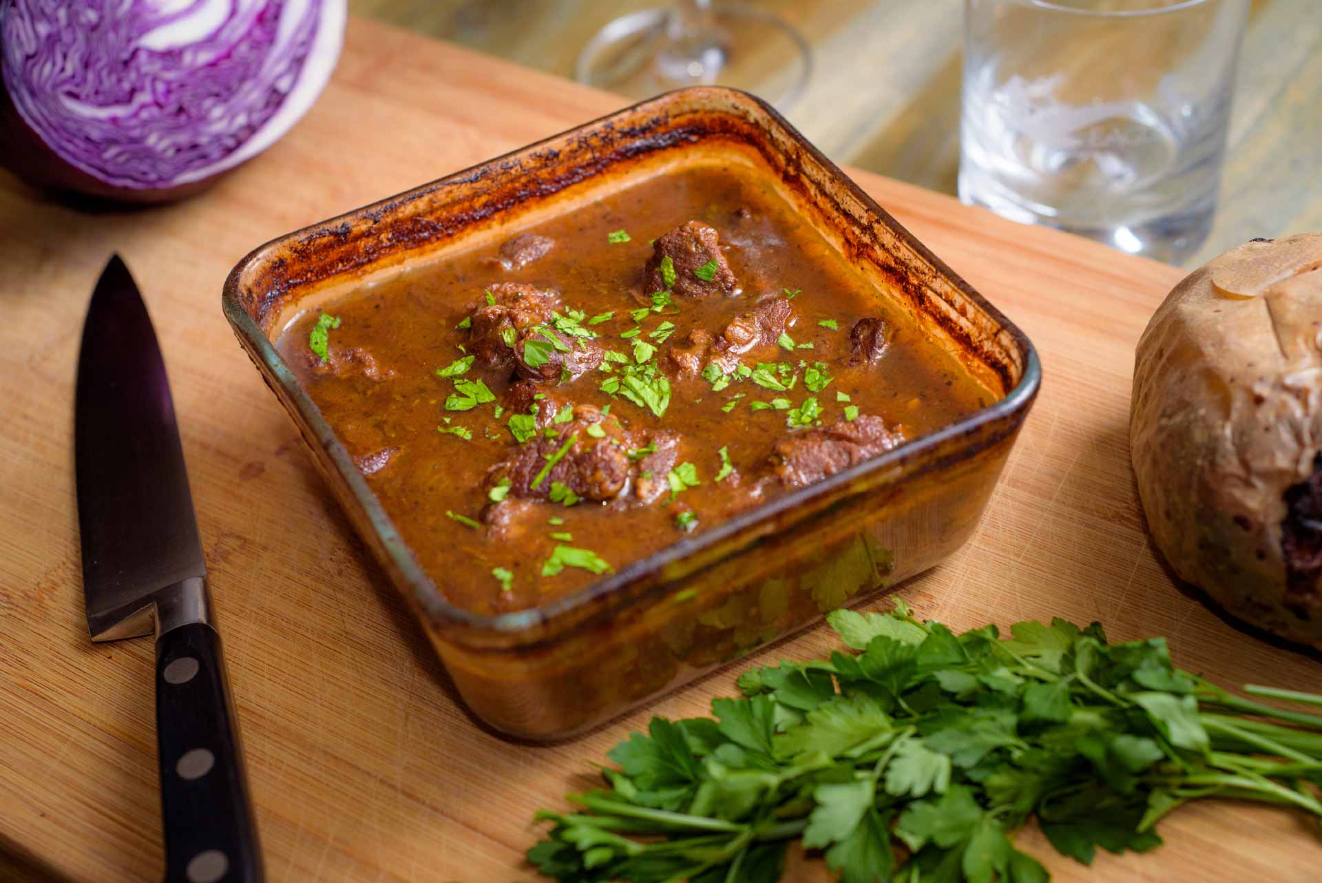 Cooked Venison Carbonnade in pyrex dish